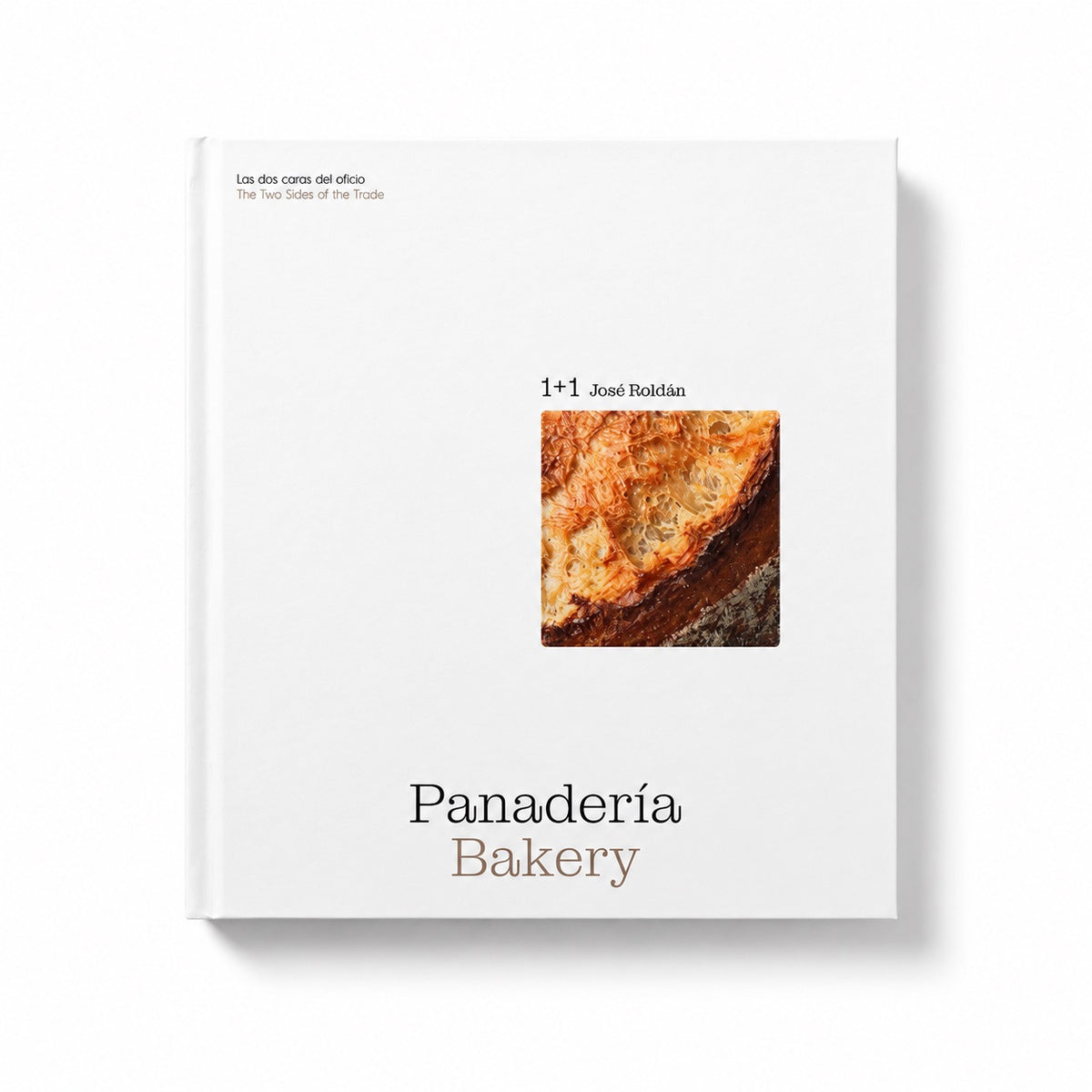 A hardcover book titled 'Panadería Bakery' by José Ribérdé, featuring a minimalist white cover with a small photograph of a baked pastry and black and brown typography, shown on a clean white background.