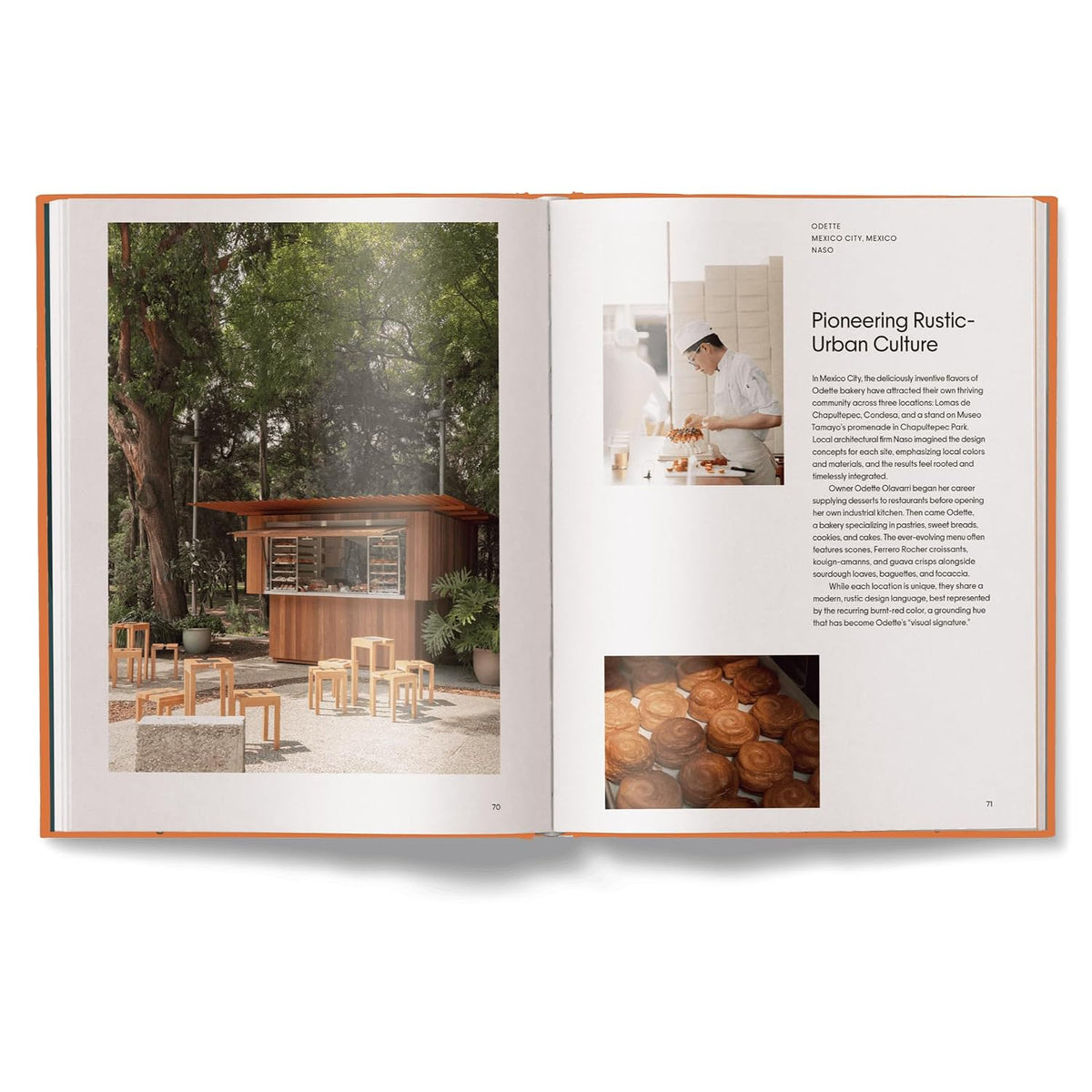 An open book or magazine spread with two pages, showing a photograph of a small wooden outdoor kitchen or cafe structure on the left page and an article layout with text and a photo on the right page. The pages are set against a clean white background with a soft shadow underneath.