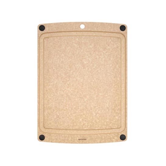 Natural Epicurean cutting board with non-slip feet on a white background