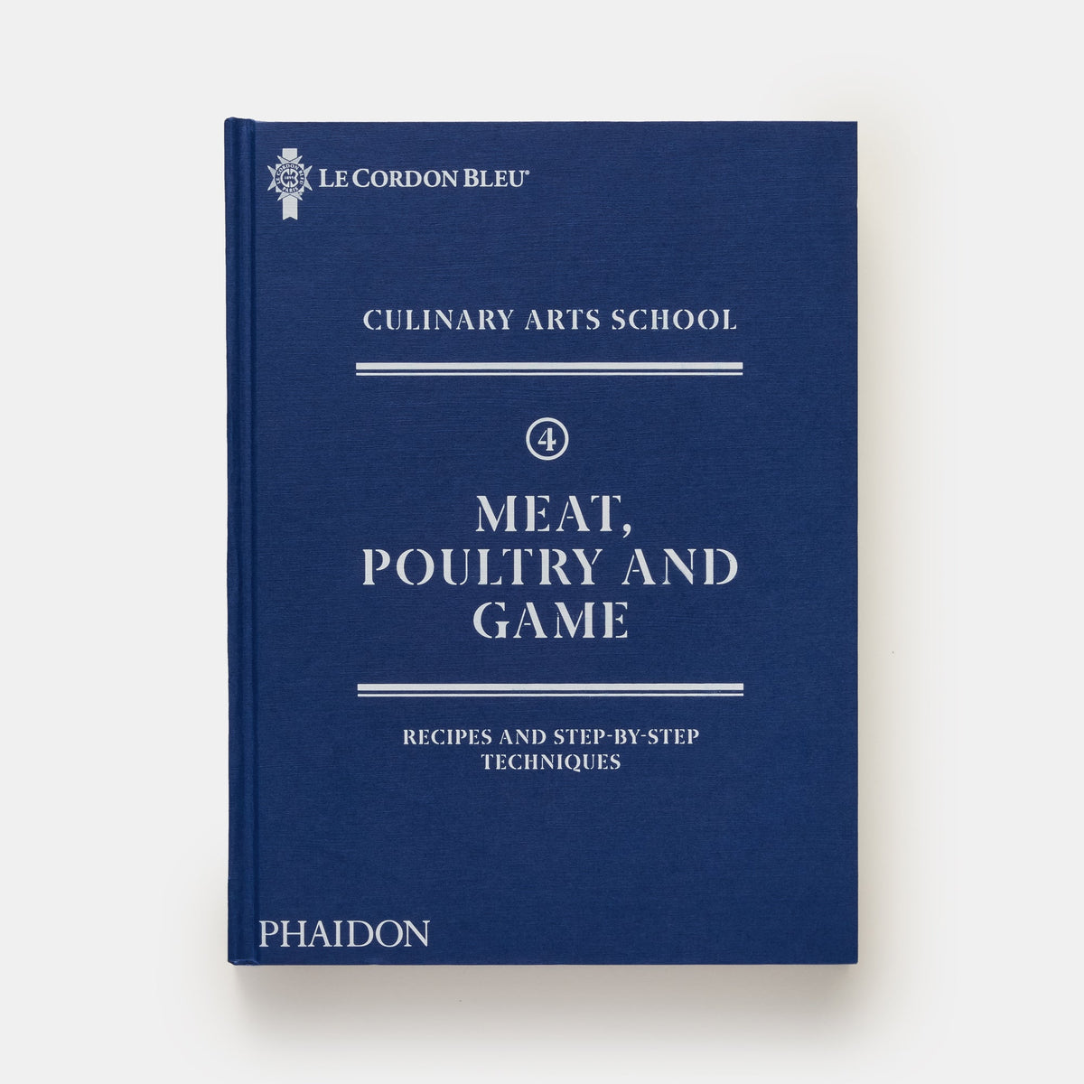 A hardcover book titled 'Meat, Poultry and Game' from Le Cordon Bleu Culinary Arts School, published by Phaidon. The book cover is a deep navy blue with white text and decorative lines, set against a clean white background.