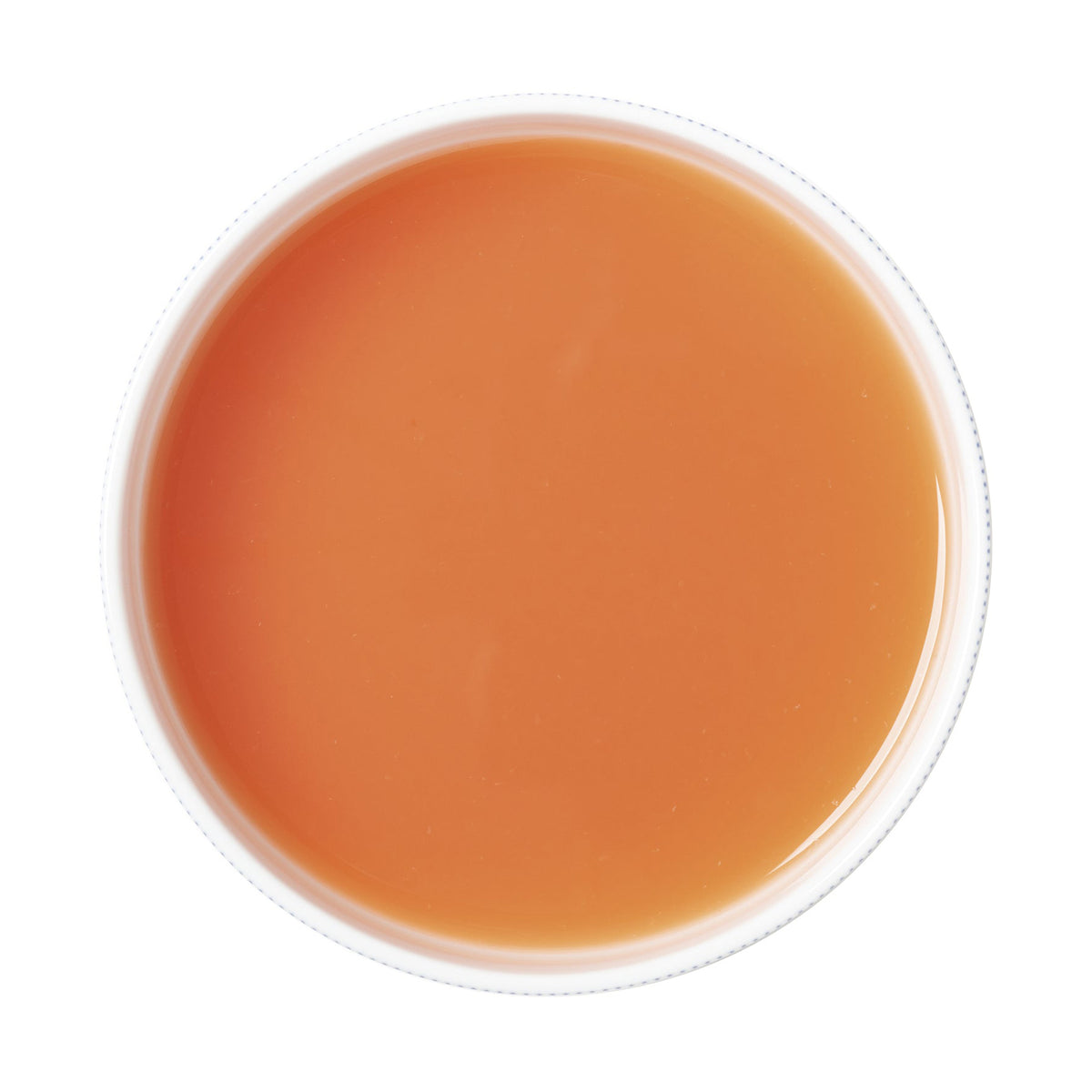 Round container with grapefruit puree on a white background