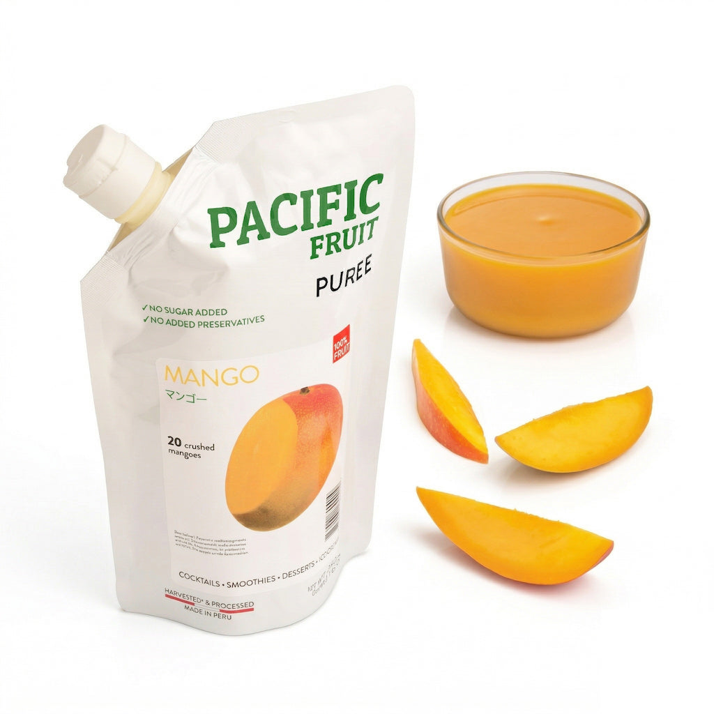 Pacific Fruit Puree Mango packaging with a glass of puree and mango slices on a white background