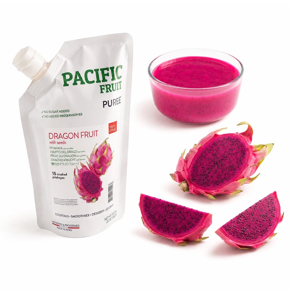 Pacific Fruit Puree Dragon Fruit pouch next to a glass bowl of bright magenta drink, with dragon fruit slices and halves displayed on a white background.