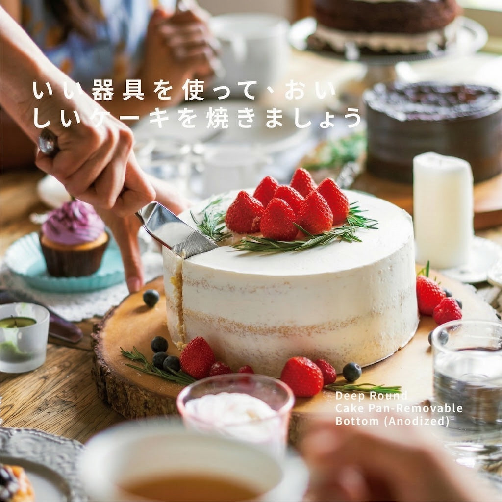 Decorative cake with strawberries on a wooden table with people around