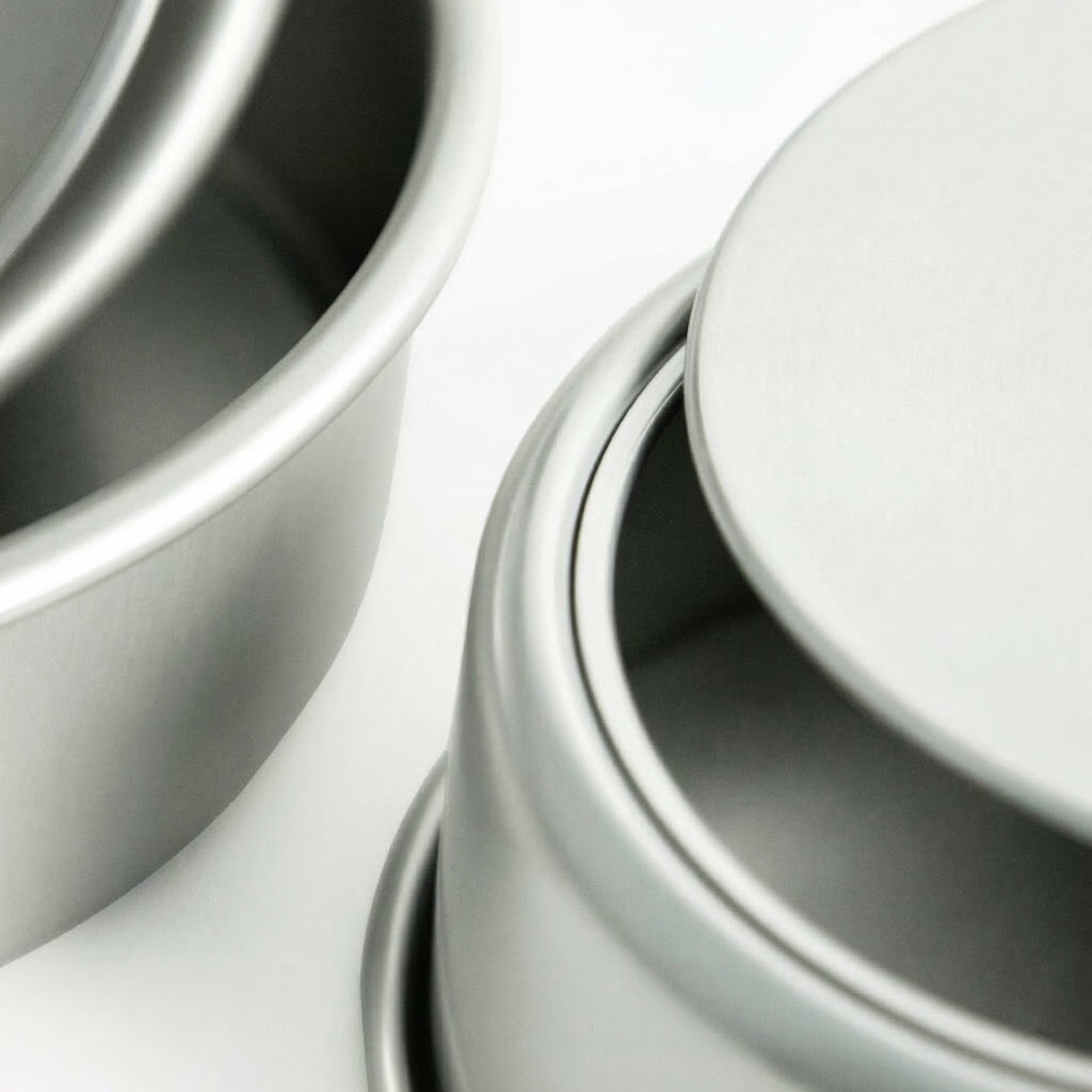 Close-up of the back of Sanneng Anodized Deep Round Cake Pan with removable bottom on a white background