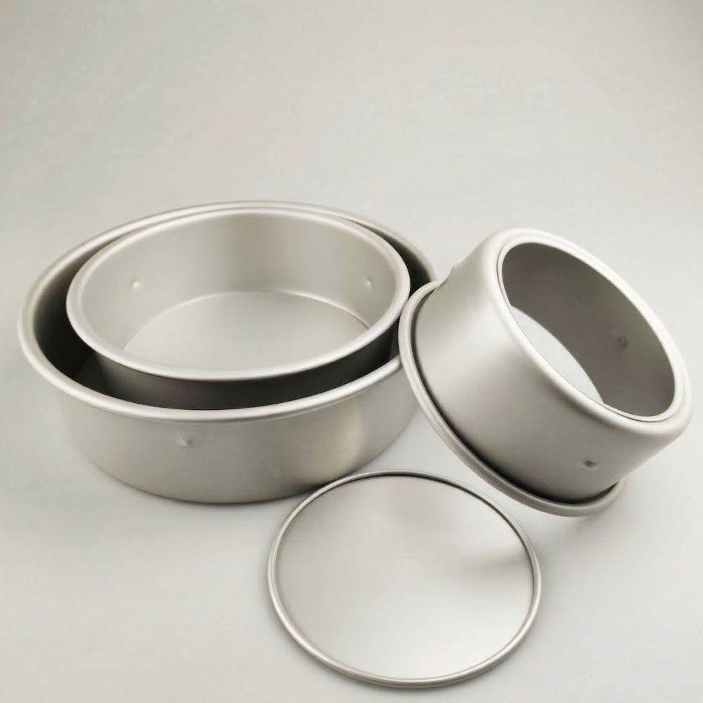 Set of Sanneng Anodized Deep Round Cake Pan with removable bottom on a light gray background