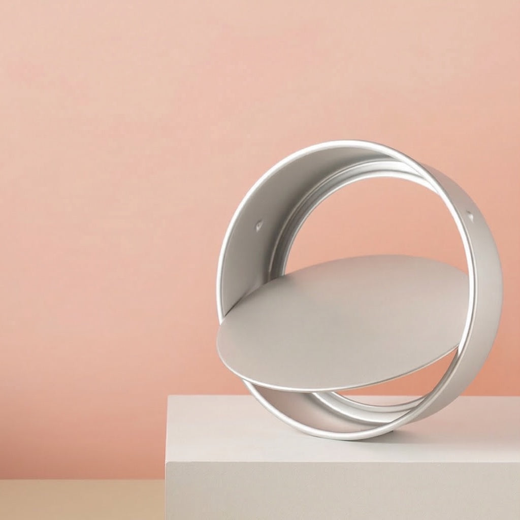 Sanneng Anodized Deep Round Cake Pan with removable bottom on a stand