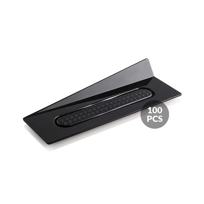 Black rectangular tray with textured bottom on a white background