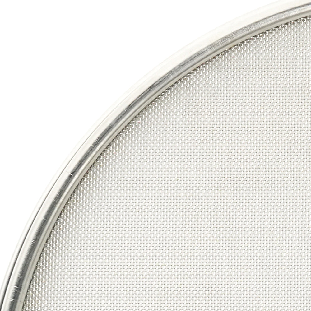 Close-up of a metallic mesh filter on a white background