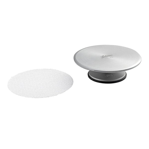 Round Ateco 613 aluminum cake turntable with a white non slip pad on a white background
