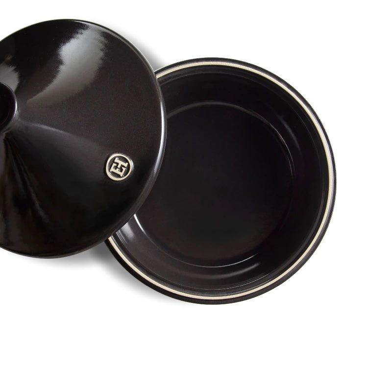 Black fusain ceramic tagine with lid and a Emile Henry logo on a white background