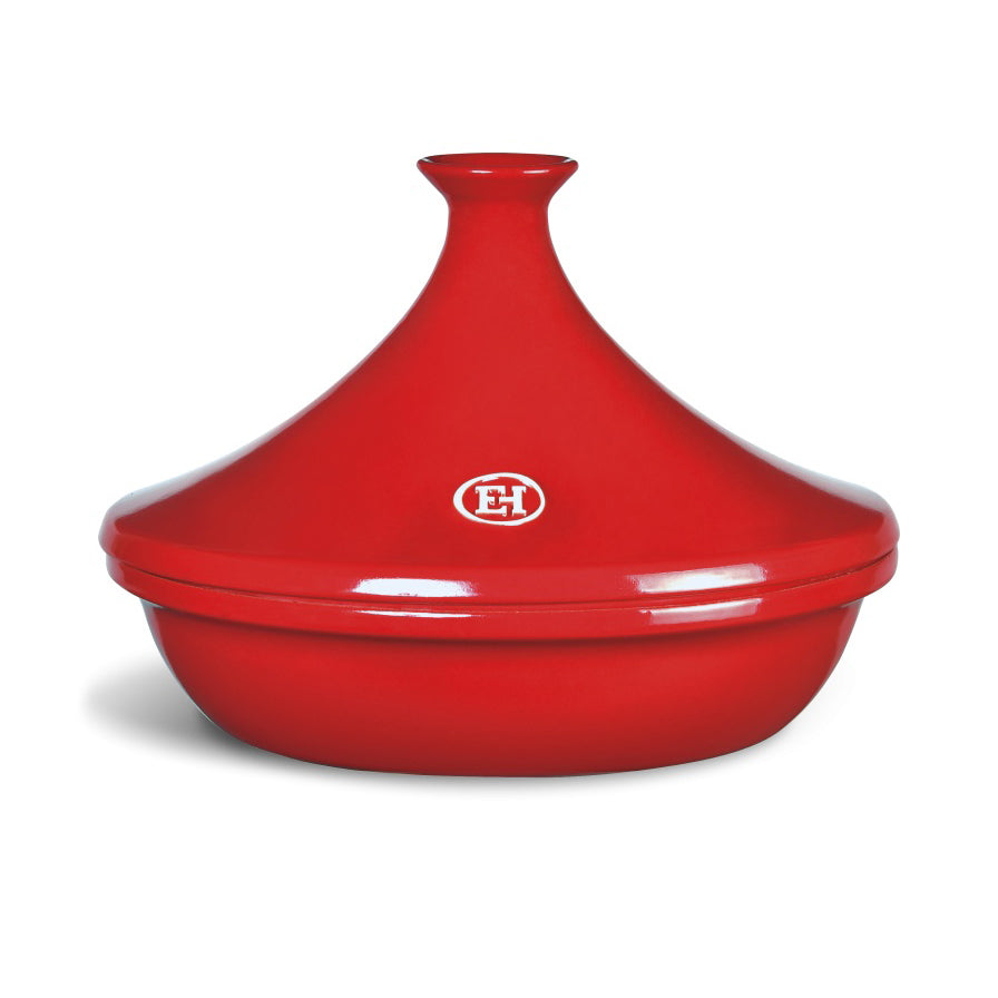Red grand cru ceramic tagine with a Emile Henry logo on a white background