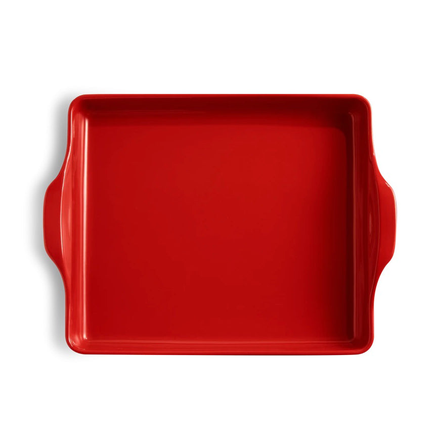 Emile Henry red grand cru focaccia bread baker with handles on a white background