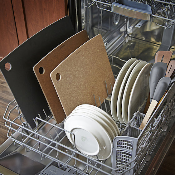 Dishwasher with cutlery, plates, and Epicurean kitchen series original cutting boards inside