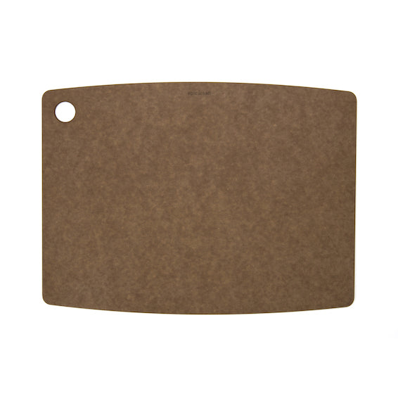 Large Epicurean kitchen series cutting board in nutmeg with a round hanging hole on a white background