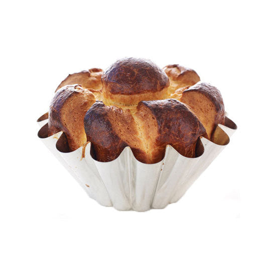 Brioche bread in a Gobel fluted mould on a white background