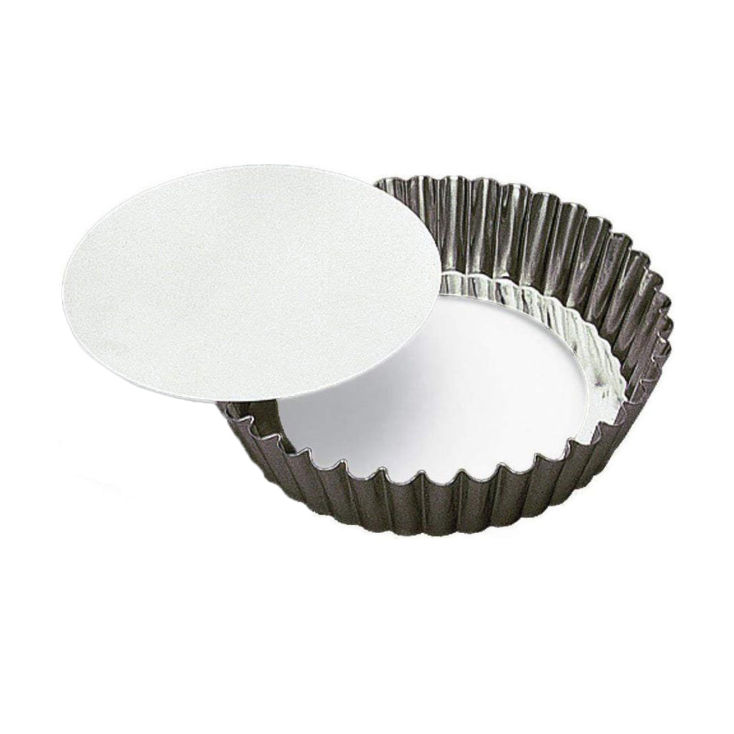 Gobel tinplate fluted round tart mould with a removable bottom on a white background