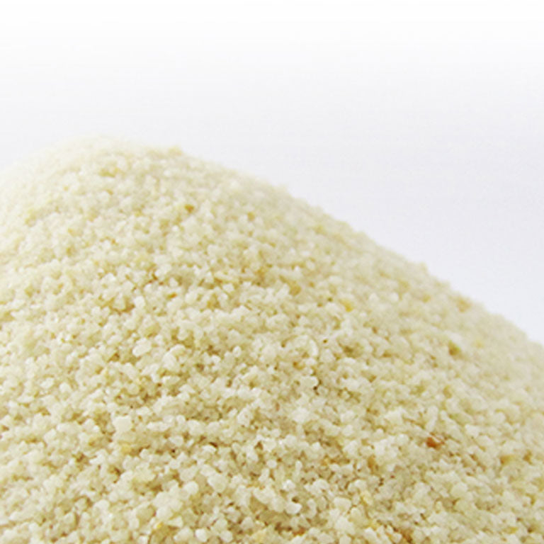 Close-up of a mound of light brown Hoshino natural bread starter yeast on a white background