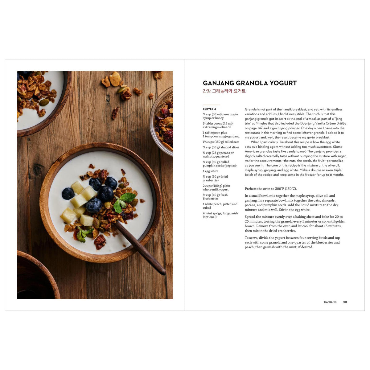 An open cookbook or recipe book spread showing a photograph of granola and yogurt on a wooden table on the left page, and the recipe title 'GANJANG GRANOLA YOGURT' with text on the right page.