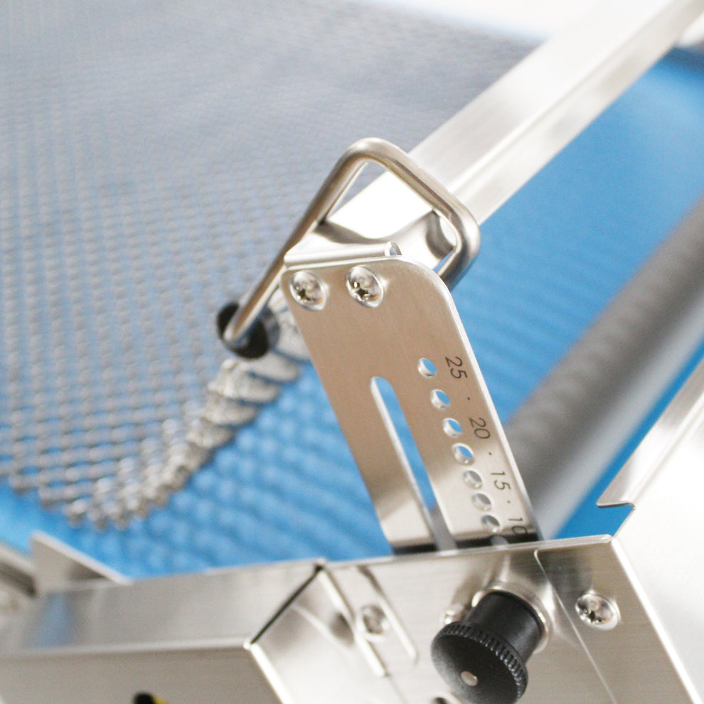 Metallic adjustment knob with measurement markings on a Kneader dough sheeter