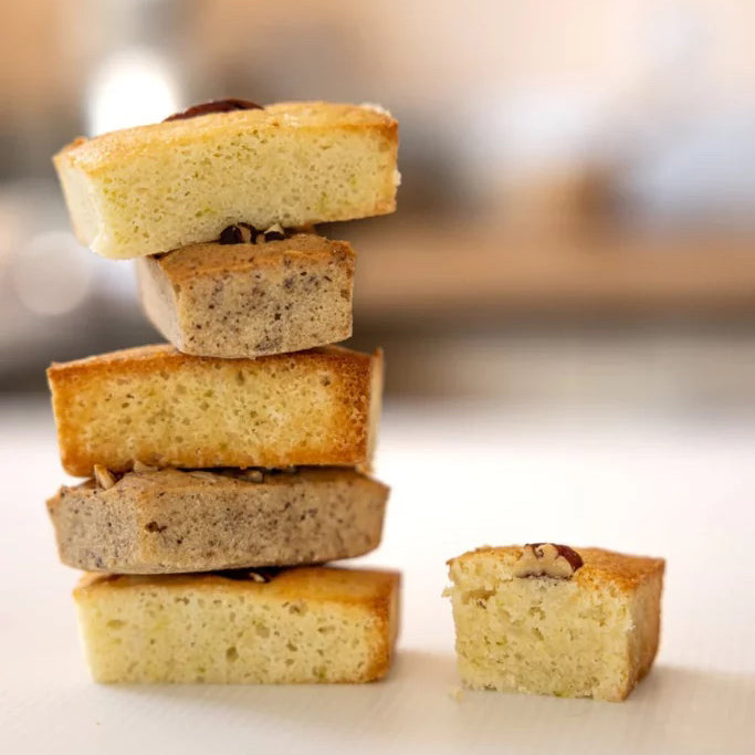 Stack of small rectangular cakes with a blurred background