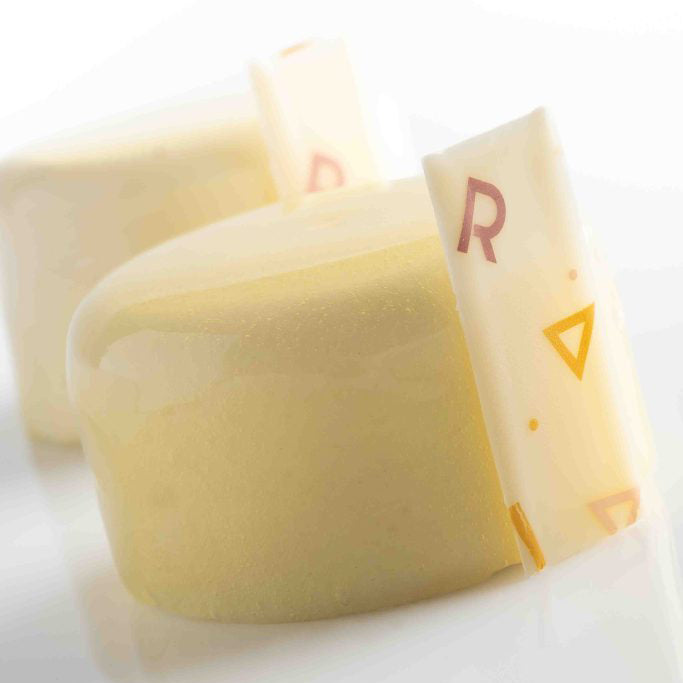 Two pieces of cake on a white background