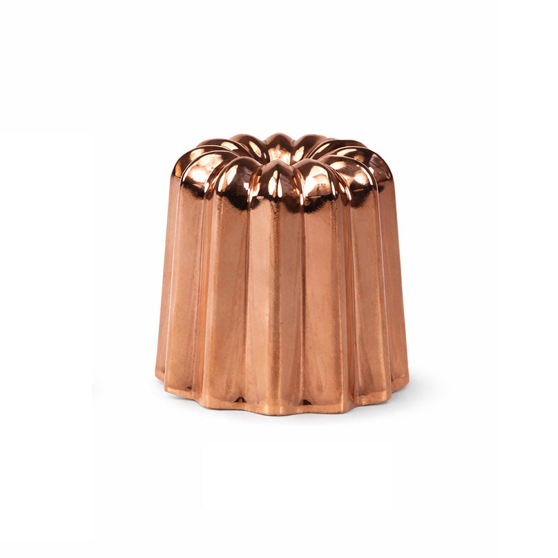 Copper Bundt cake mold on a white background