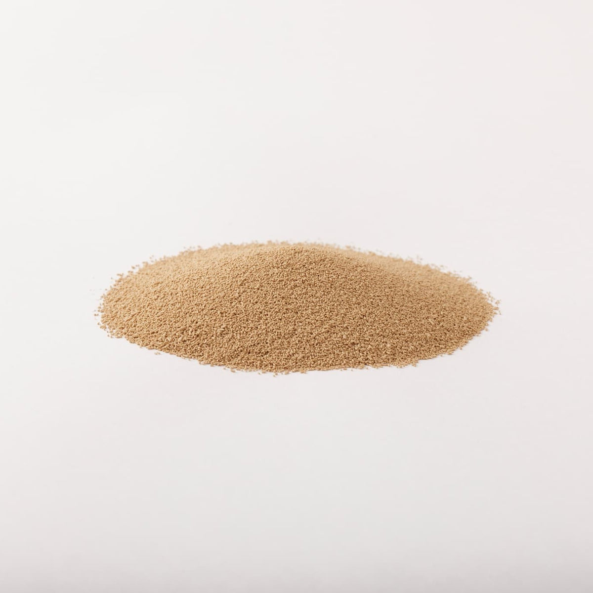 Pile of Hokkaido dry yeast on a light gray background