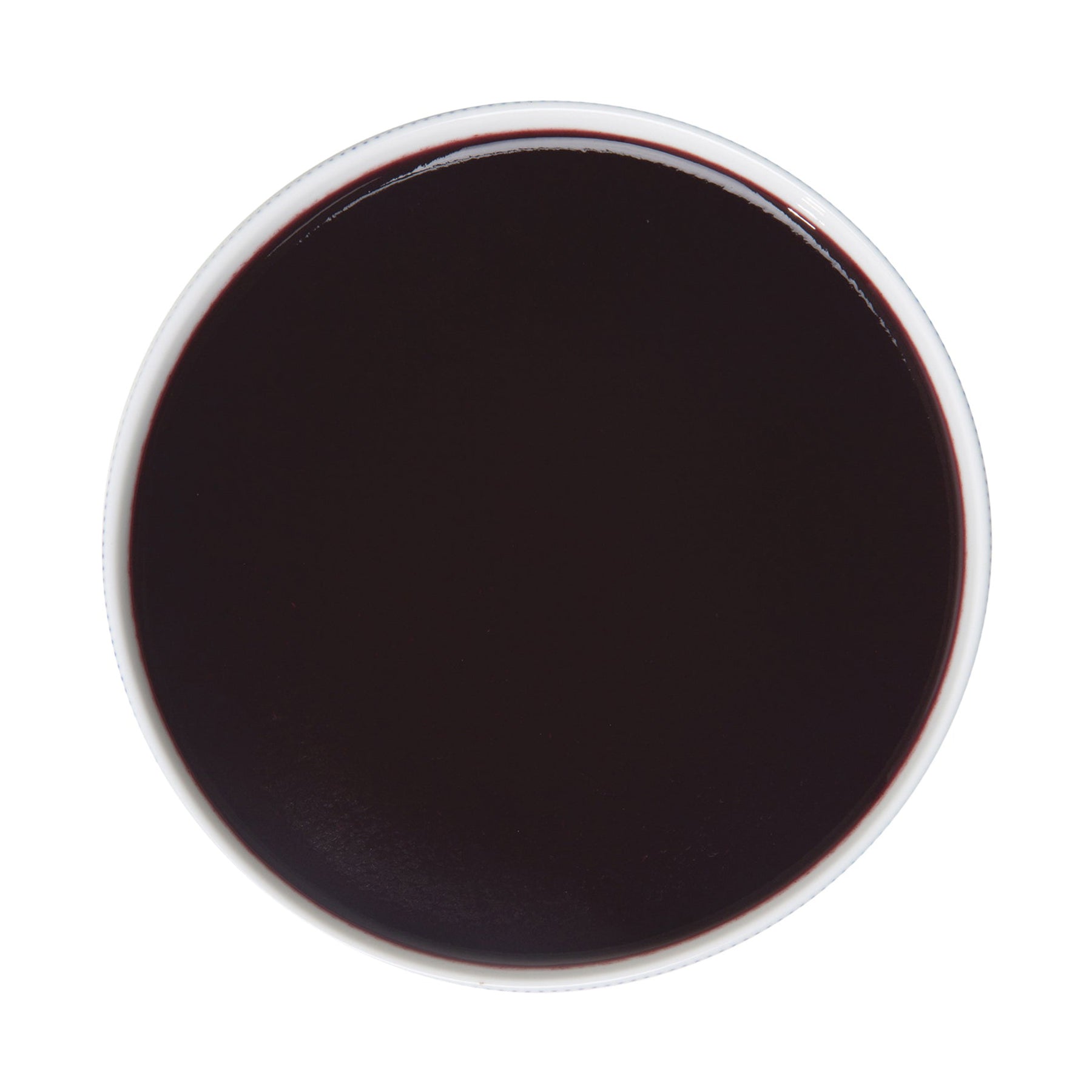 Top-down view of Pacific Fruit blueberry puree on a white background
