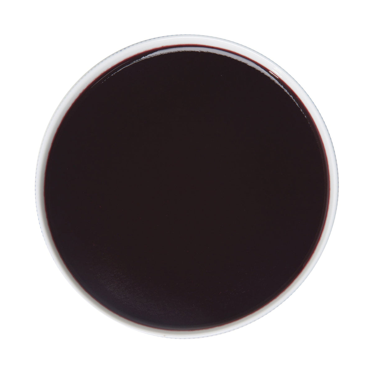 Top-down view of Pacific Fruit blueberry puree on a white background