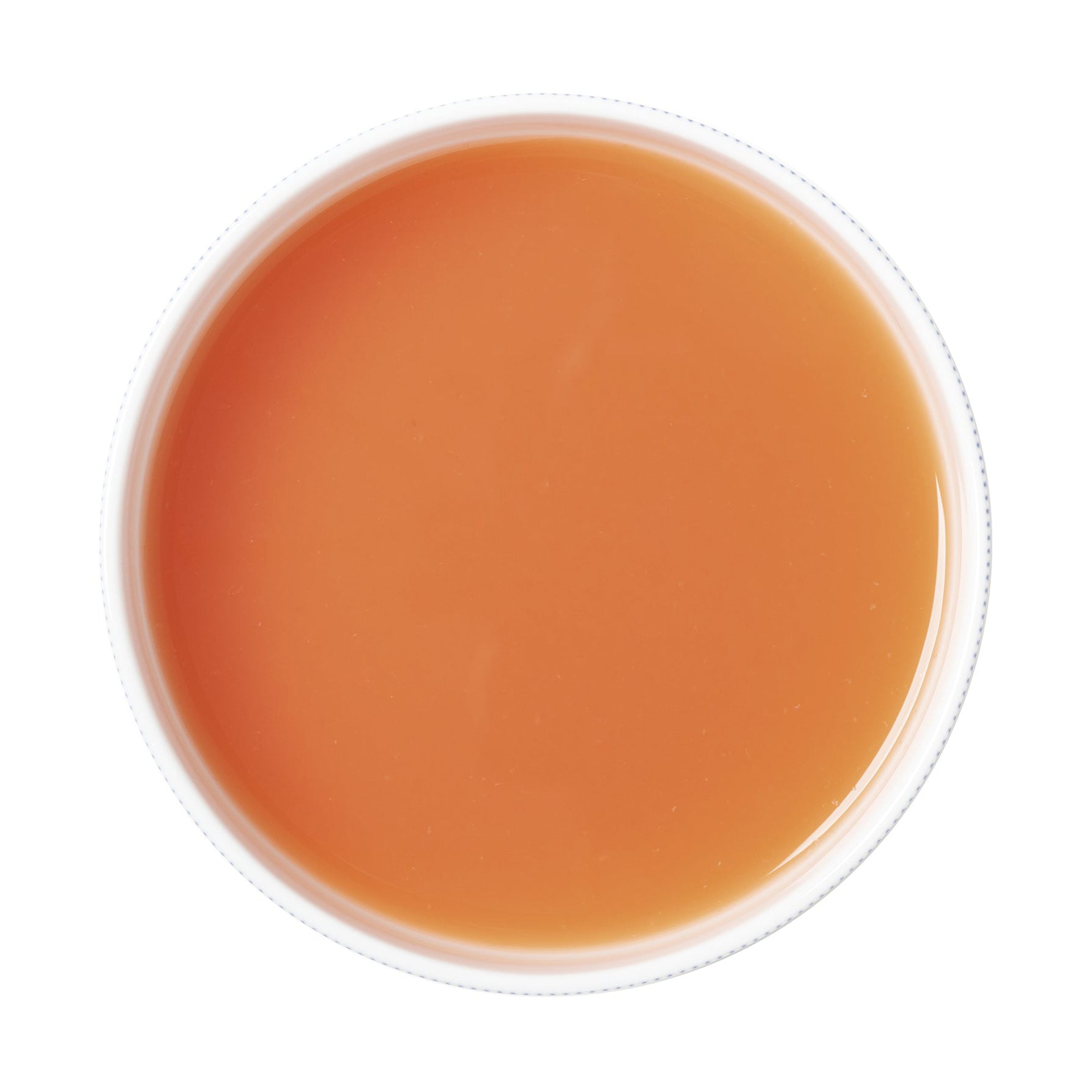 Round container with grapefruit puree on a white background