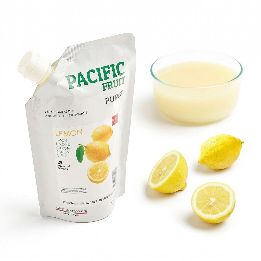 Pacific Fruit Lemon juice pouch with lemons and a glass on a white background