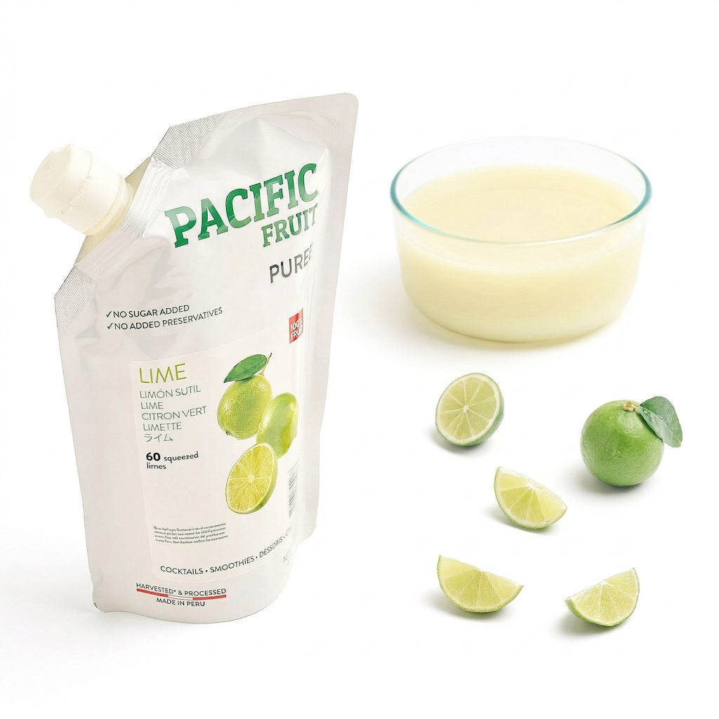Pacific Fruit Puree lime pouch with a glass bowl of lime puree and lime slices on a white background