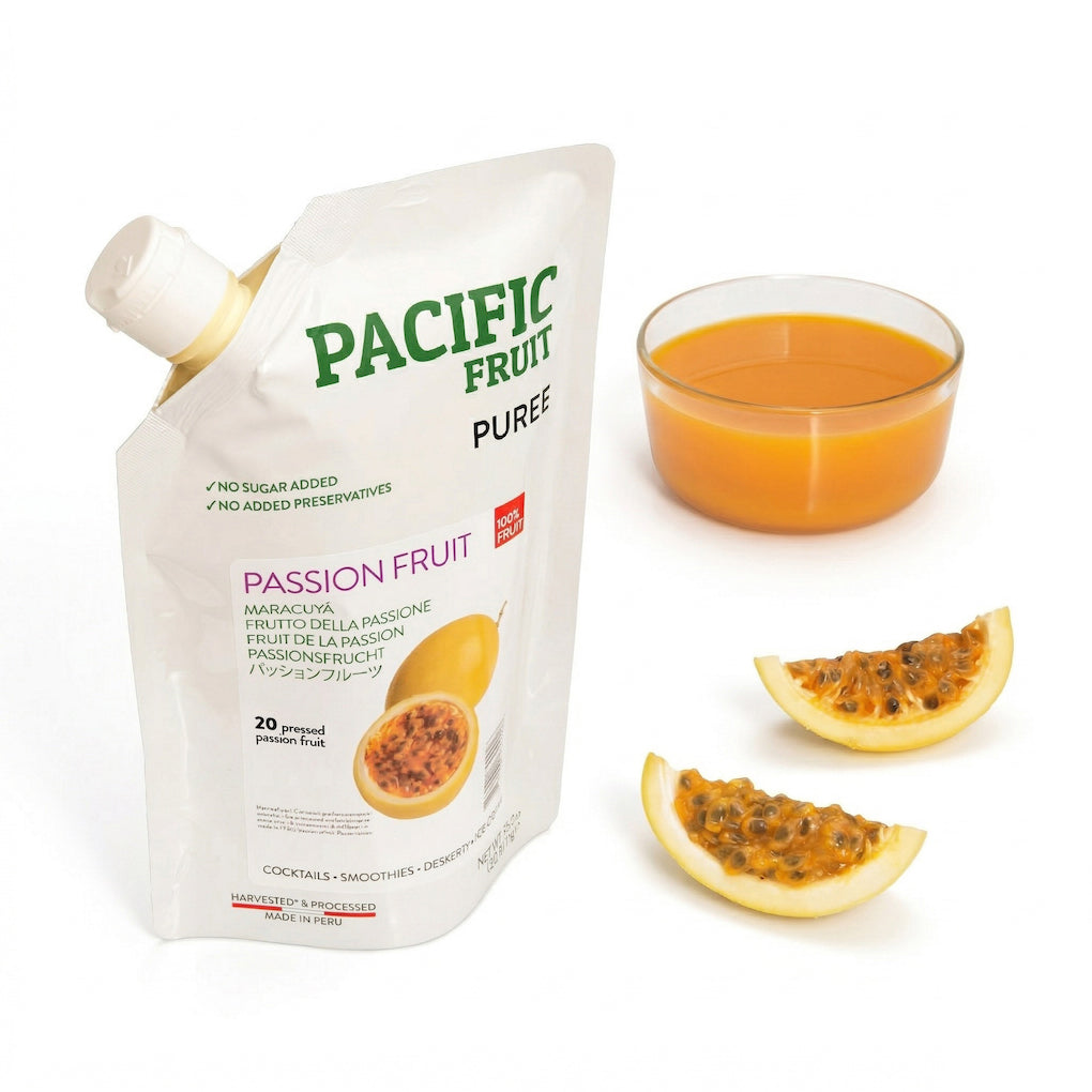 Pacific Fruit passion fruit puree packaging with a glass of puree and passion fruit slices on a white background