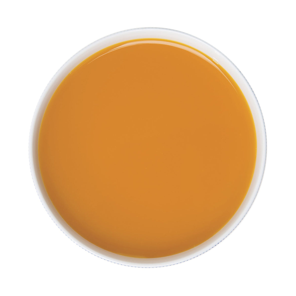 Round container of passion fruit puree on a white background