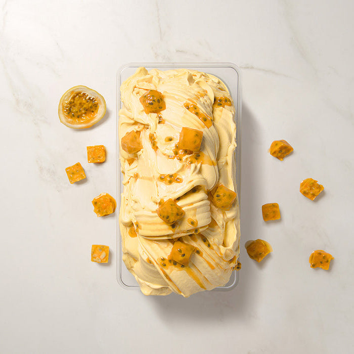 Passion Fruit Ice cream with passion fruit pieces on a light background