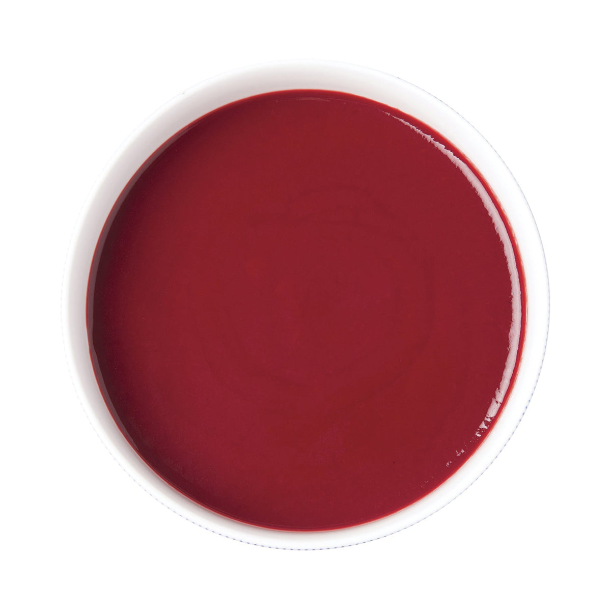 Raspberry puree in a white container on a white background