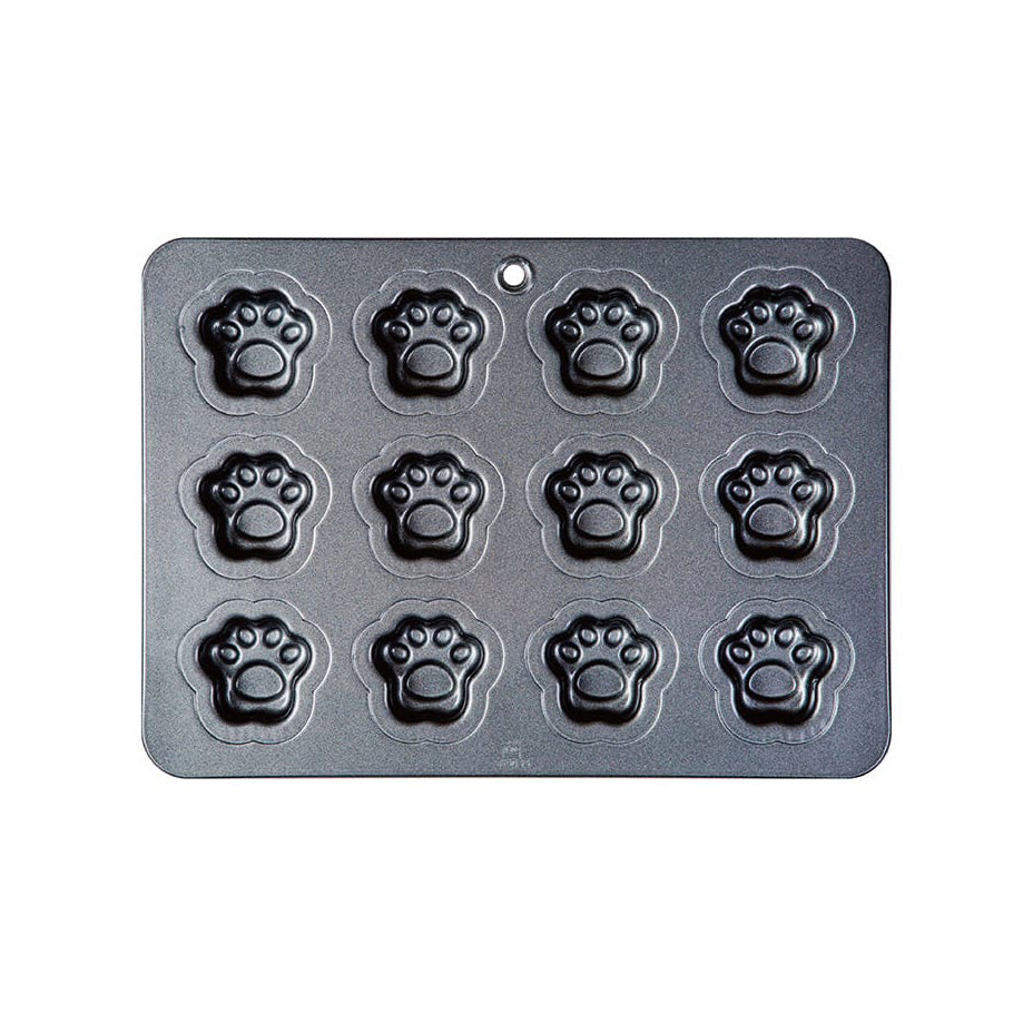 A rectangular dark gray Sanneng metal baking pan with twelve paw-print shaped cavities arranged in a 3-by-4 grid, shown on a plain white background.