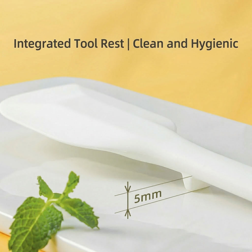Sanneng white heat-resistant silicone spatula with integrated tool rest and 5mm measurement, on a yellow background.