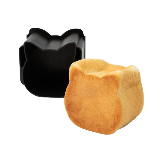 A black Sanneng cat-shaped baking mold shown empty in the back, with a golden-brown baked loaf of bread in the front, on a plain white background.