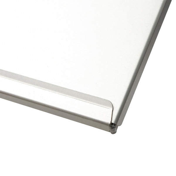 Close-up of a white rectangular panel with a brushed silver metal edge and rounded corner on a white background.