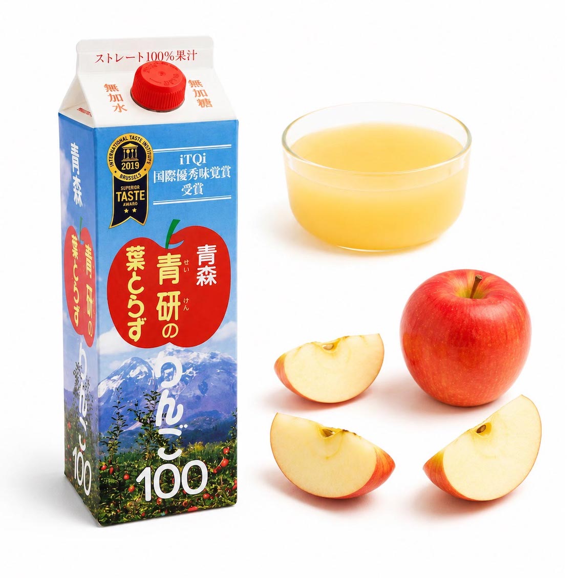 A carton of Japanese Aomori apple juice with a glass of pale golden juice, a whole red apple, and three apple slices on a white background. The carton features blue mountain scenery, a red apple graphic, and Japanese text.