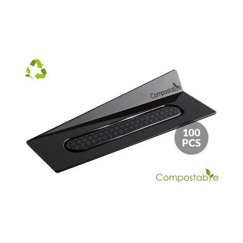 Black compostable product packaging with 'Compostable' label on a white background