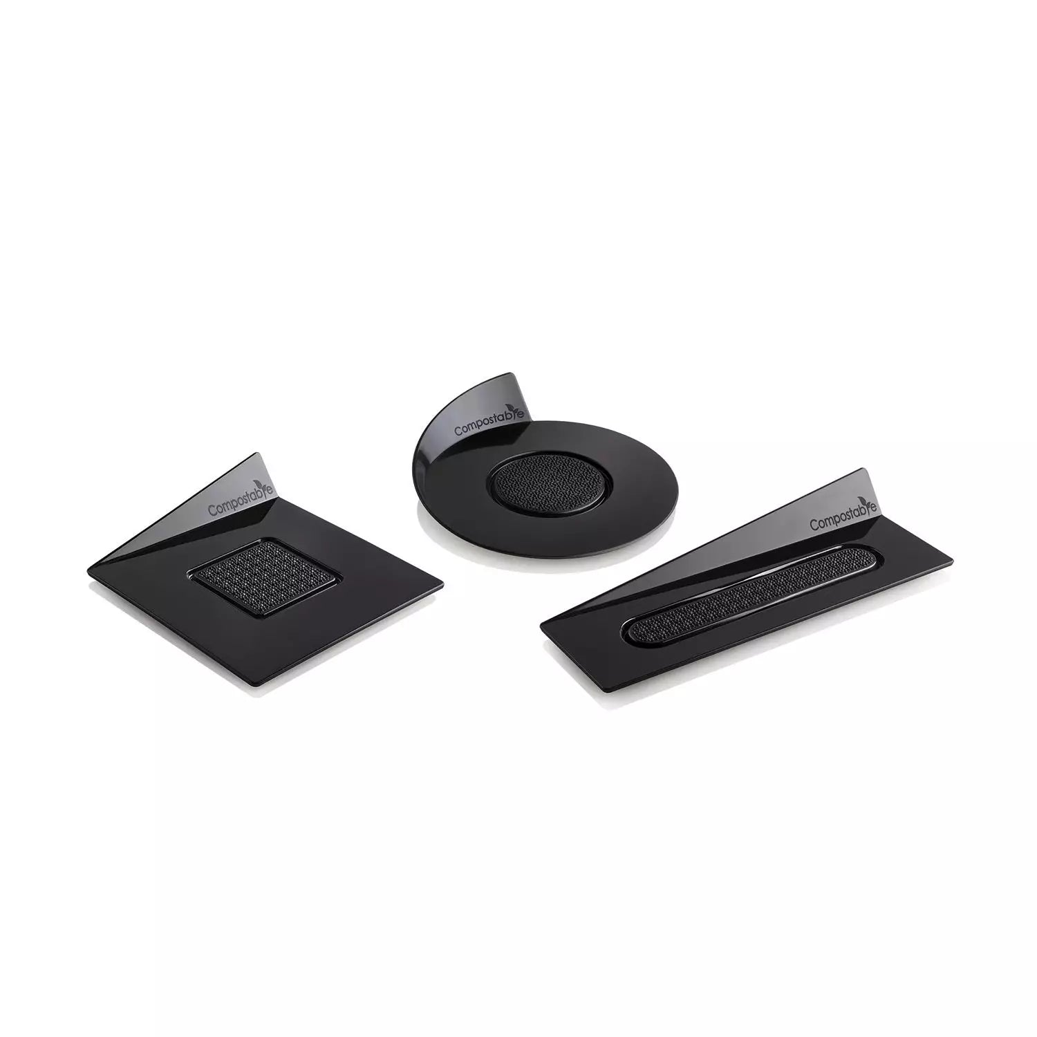 Set of three black compostable trays on a white background