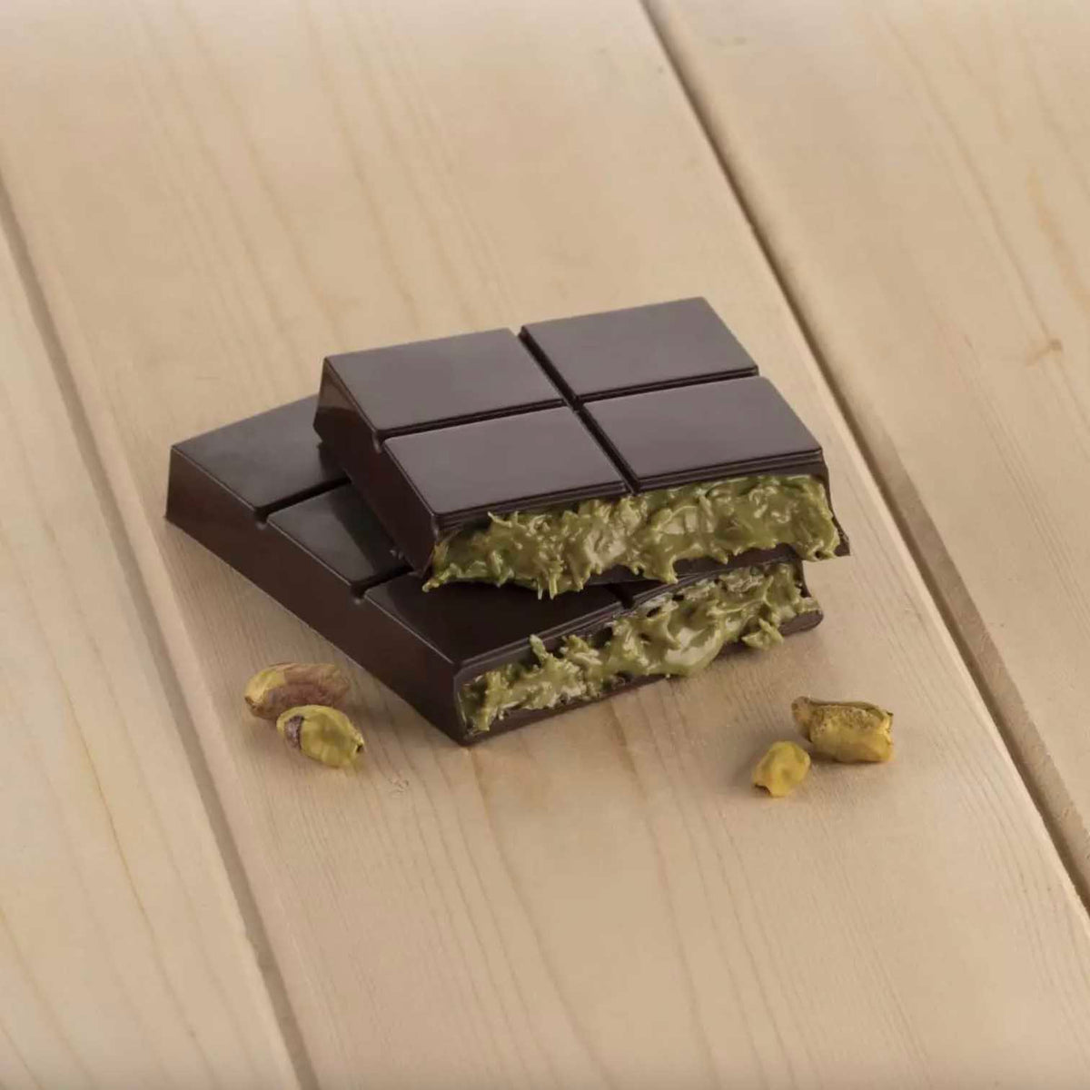 Chocolate bar with its filling on a wooden surface