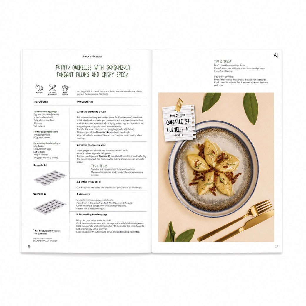 An open printed Silikomart recipe book spread showing preparation instructions for potato chennelle with garcinja pendant filling and crispy speck, alongside a plated prepared dish and utensils on a beige surface.