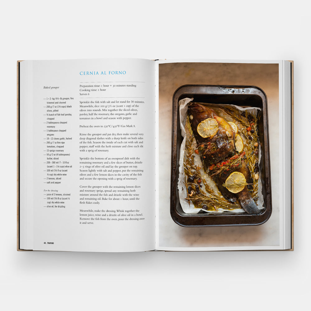 An open cookbook spread showing a recipe for Cieria al Forno, with text on the left page and a prepared dish in a baking tray on the right page, photographed on a light gray background.