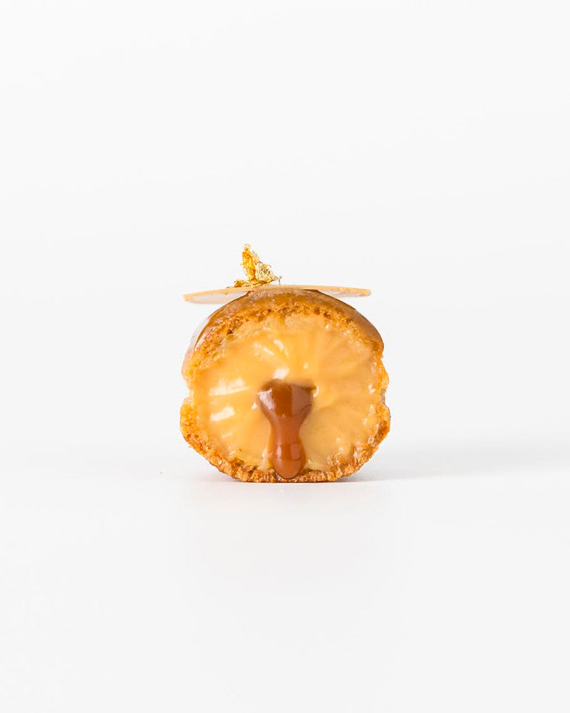 Donut with caramel glaze on a white background