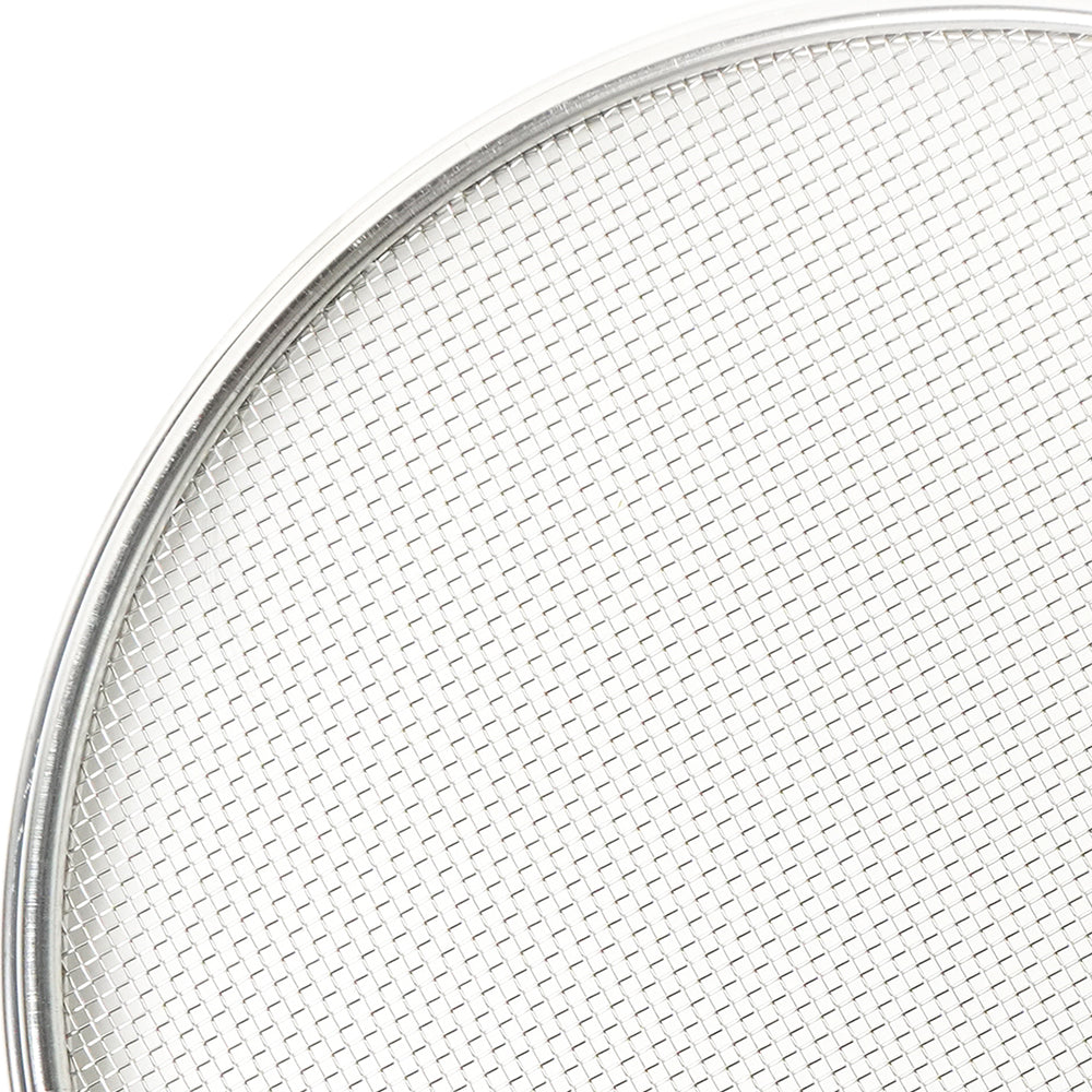 Close-up of a round metal screen with a white background