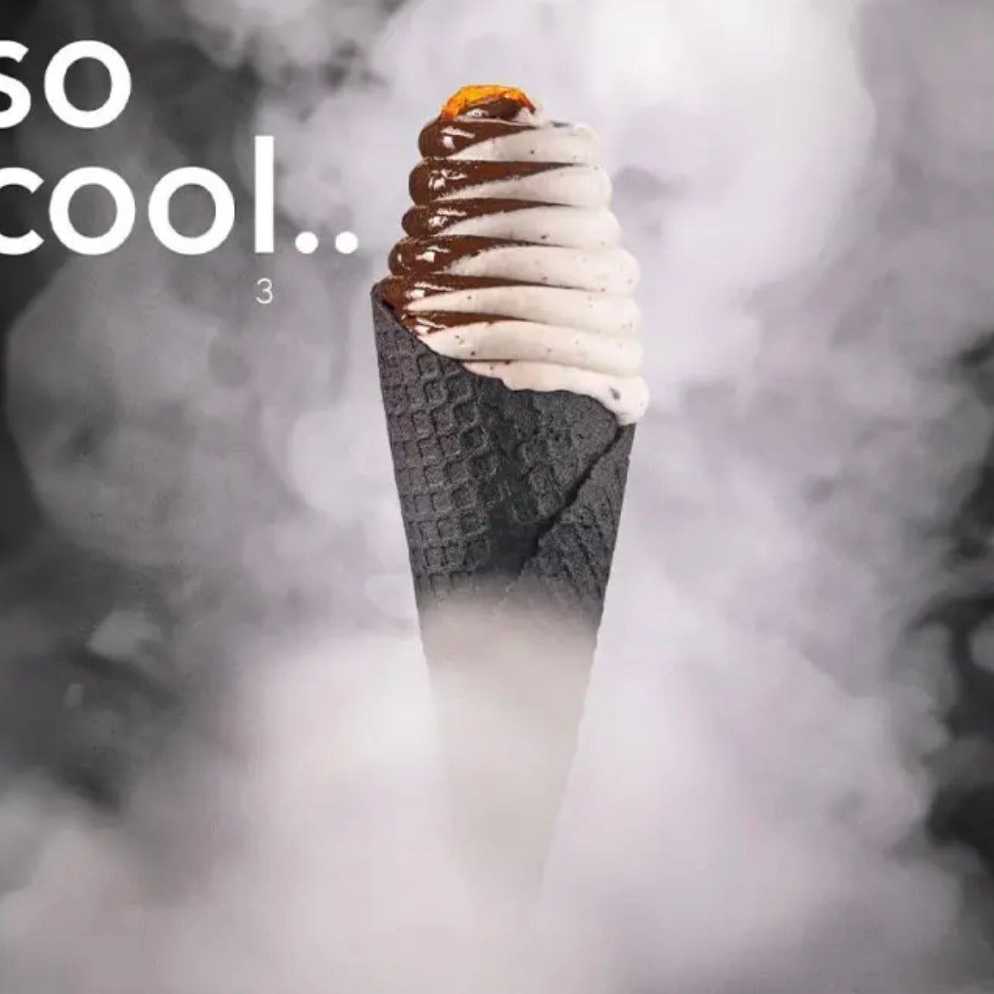 Ice cream cone with white and chocolate sauce in a waffle cone, surrounded by smoke on a dark background.